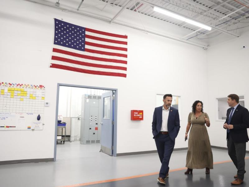 Rep. Pappas stands with Adria and Aaron Bagshaw, owners of W.H. Bagshaw