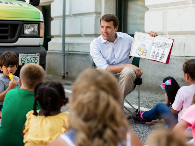 Chris reads to children at the Manchester Public Library