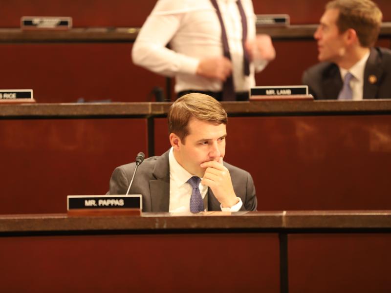 Congressman Chris Pappas in his committee seat looking concerned. 