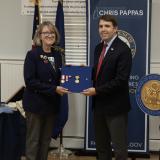 Congressman Pappas (right) presenting a WWI Victory Medal and a WWI Victory Button Bronze for Grace Derby Banker to her granddaughter, Carolyn Timbie (left)