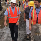 Pappas walking with construction workers
