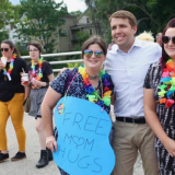 Pappas taking photos with people