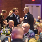 Congressman Pappas (L) shakes Chief Garone’s hand at a June 2022 event honoring Garone’s 50 years of service to Derry
