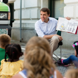 Chris reads to children at the Manchester Public Library