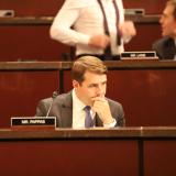 Congressman Chris Pappas in his committee seat looking concerned. 