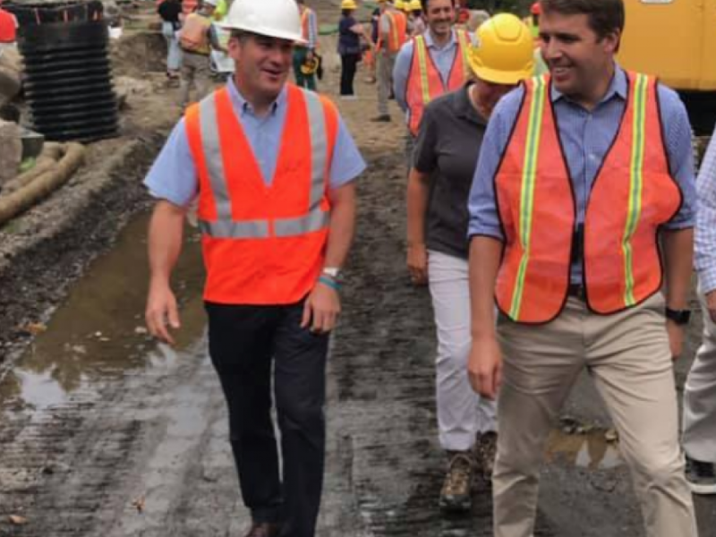 Pappas walking with construction workers